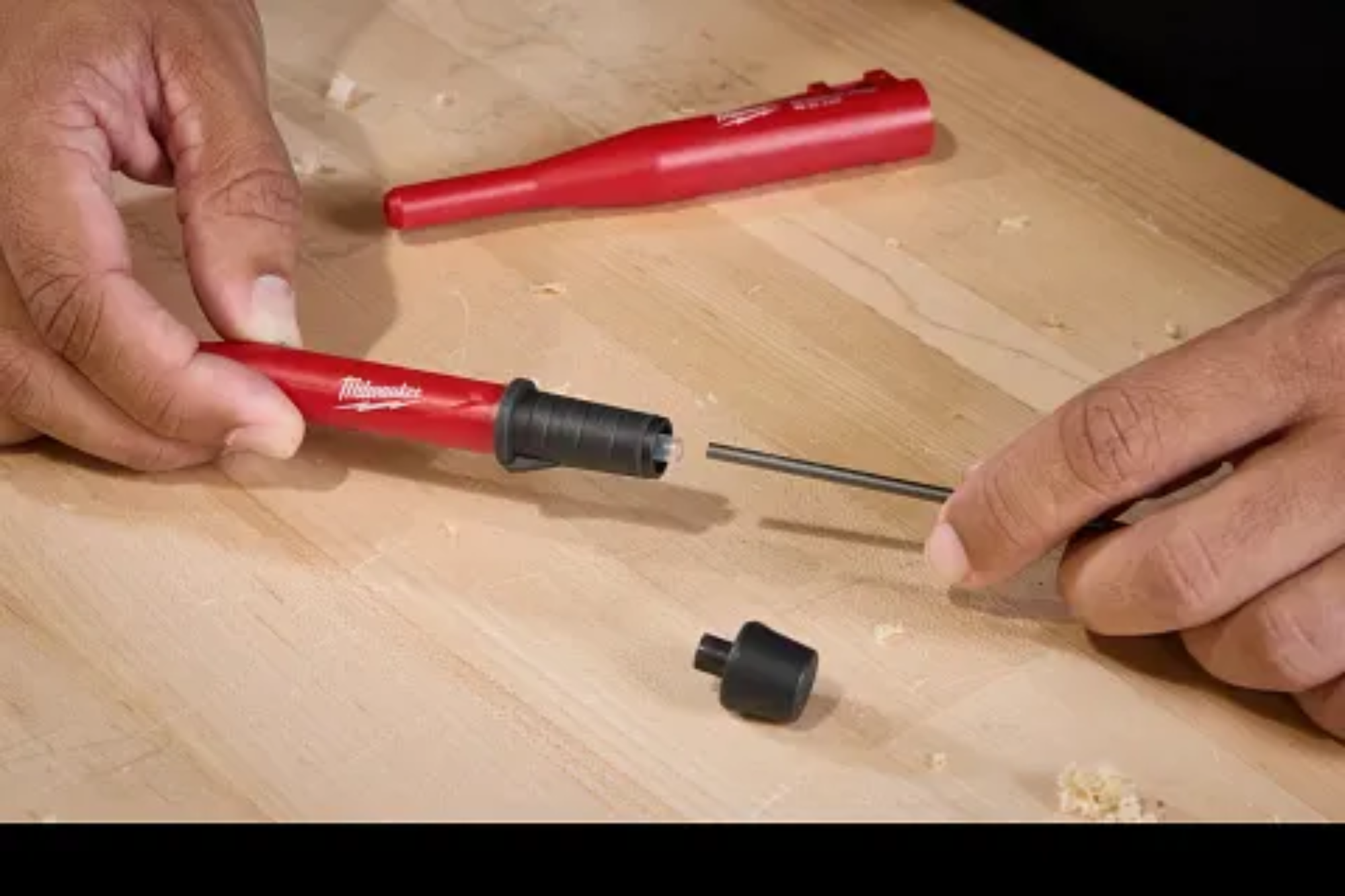 Mechanical pencil with one handed sharpening